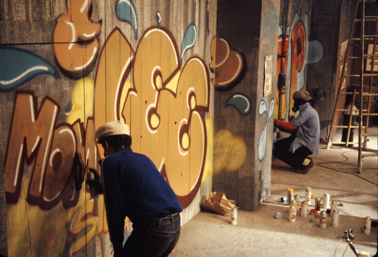 Lee Quinones and Fab 5 Freddy painting on the set of the Rapture video (1981)